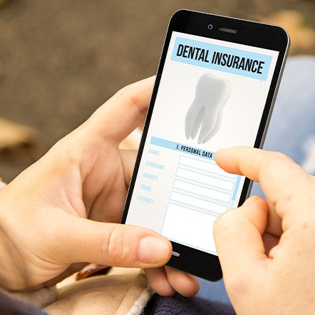 A team of dentists performing a dental implant surgery